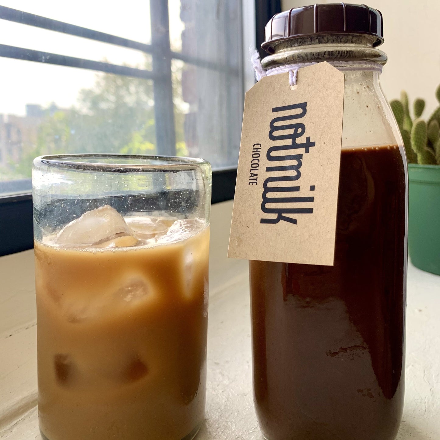 The Perfect Iced Mocha = Chocolate Oat Milk + Your Favorite Coffee - Nuthatch